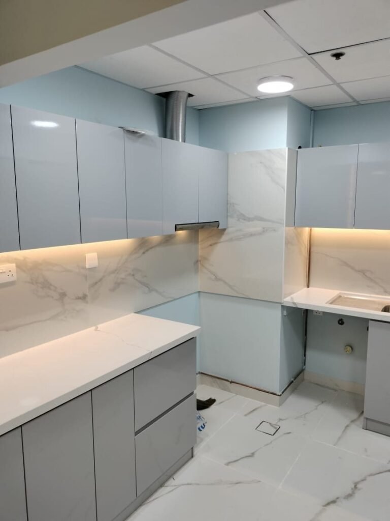 Kitchen with LED-lit marble backsplash – Apartment Fit-out – Al Furjan