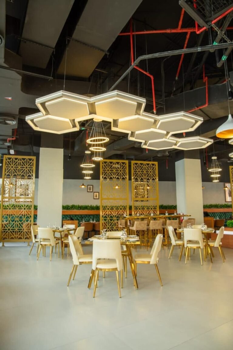 Dining hall with hexagon pendant lights – Pepper Mill Restaurant – Yas Mall, Abu Dhabi