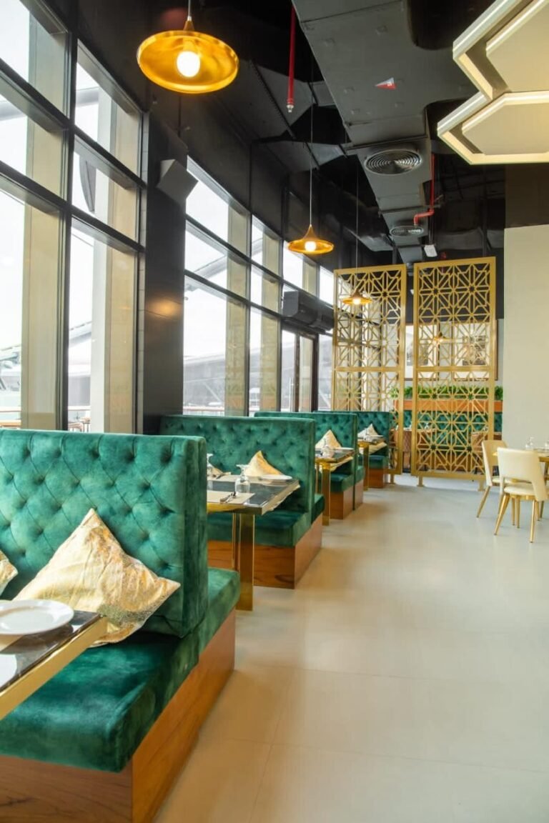 Green tufted banquette seating – Pepper Mill Restaurant – Yas Mall, Abu Dhabi